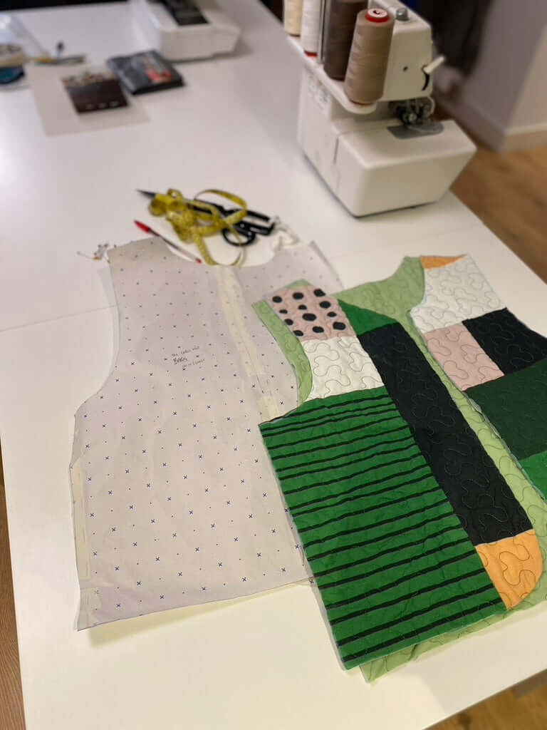 sustainable quilted vest pattern pieces, cut on table ready to be sewn.